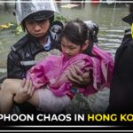 Hong Kong skyline under storm alert as Super Typhoon Ragasa approaches, causing school closures and flight cancellations.